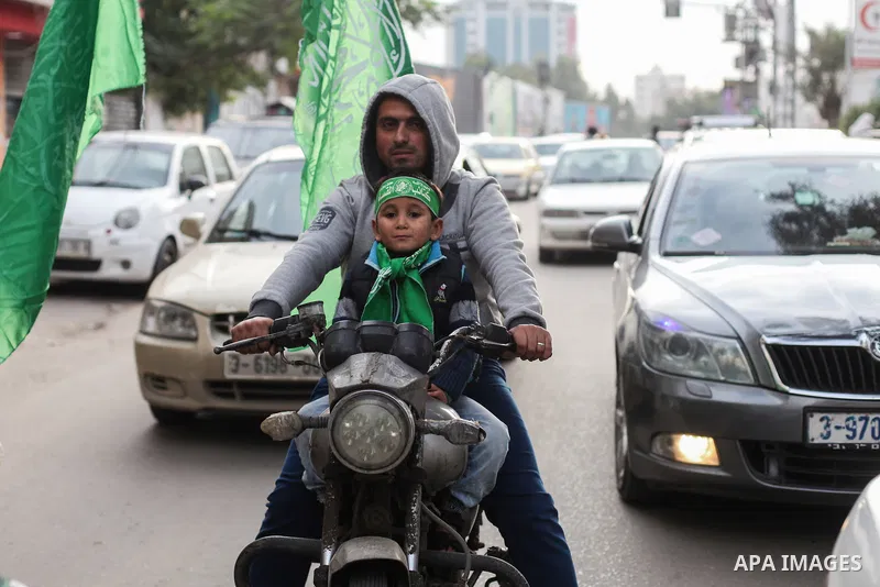 A Palestinian walks in a street, Marking the 32th anniversary of the founding of the Hamas movement, in Gaza city on December 11, 2019. Photo by Mahmoud Ajjour