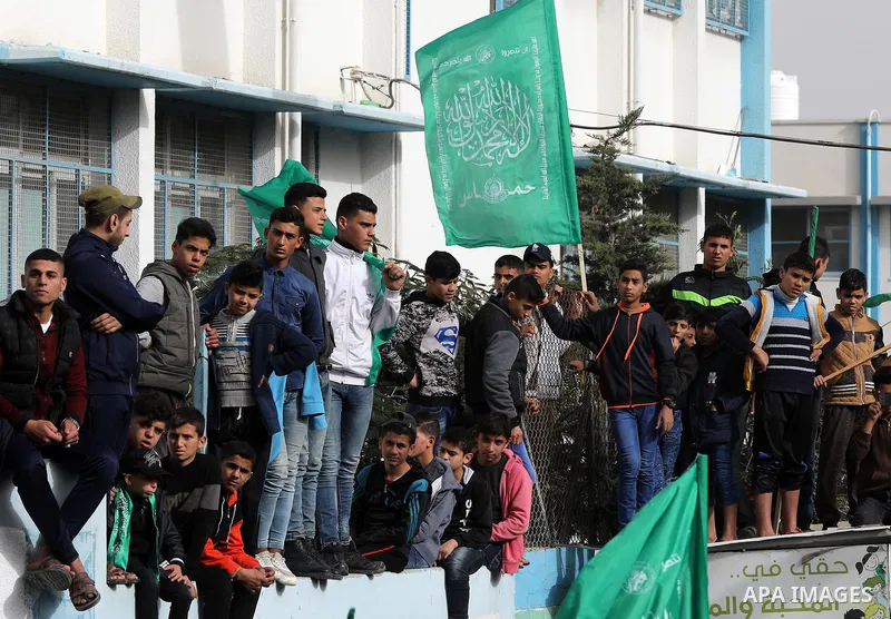 Palestinian Hamas supporters gather to attend a Hamas rally marking the 32th anniversary of the Islamist movement's founding In Jabalia, northern Gaza Strip, on December 13, 2019. Photo by Mahmoud Nasser