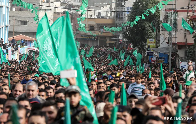 Palestinian Hamas supporters gather to attend a Hamas rally marking the 32th anniversary of the Islamist movement's founding In Jabalia, northern Gaza Strip, on December 13, 2019. Photo by Mahmoud Nasser