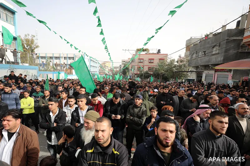 Palestinian Hamas supporters gather to attend a Hamas rally marking the 32th anniversary of the Islamist movement's founding In Jabalia, northern Gaza Strip, on December 13, 2019. Photo by Mahmoud Nasser