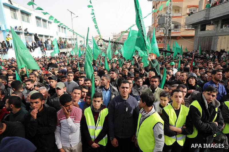 Palestinian Hamas supporters gather to attend a Hamas rally marking the 32th anniversary of the Islamist movement's founding In Jabalia, northern Gaza Strip, on December 13, 2019. Photo by Mahmoud Nasser