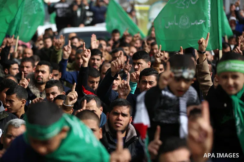 Palestinian Hamas supporters gather to attend a Hamas rally marking the 32th anniversary of the Islamist movement's founding in Khan Younis in the southern of Gaza strip, on December 13, 2019. Photo by Ashraf Amra