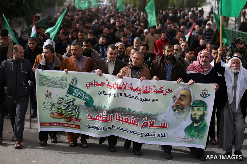 Palestinian Hamas supporters gather to attend a Hamas rally marking the 32th anniversary of the Islamist movement's founding in Khan Younis in the southern of Gaza strip, on December 13, 2019. Photo by Ashraf Amra