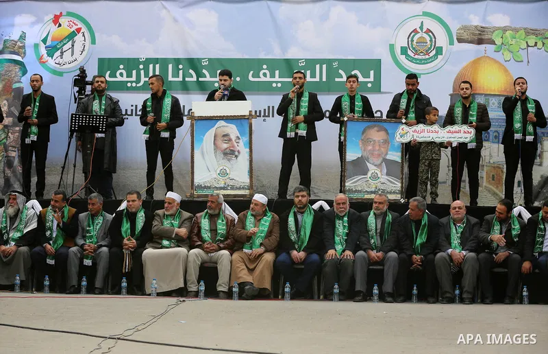 Palestinian Hamas supporters gather to attend a Hamas rally marking the 32th anniversary of the Islamist movement's founding in Khan Younis in the southern of Gaza strip, on December 13, 2019. Photo by Ashraf Amra