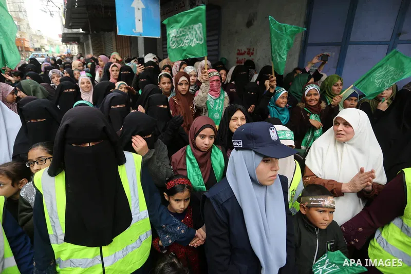 Palestinian women takes part in a marking the 32th anniversary of the Islamist movement's founding in Khan Younis in the southern of Gaza strip, on December 13, 2019. Photo by Ashraf Amra