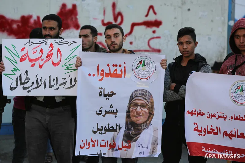 Palestinian supporters of Al-Ahrar movement take part in a protest to show solidarity with Palestinian Prisoners held in Israeli jails, in Gaza City on December 17, 2019. Photo by Mahmoud Ajjour