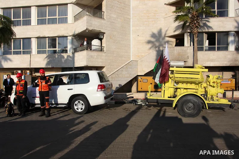Qatar's Ambassador to the Palestinian Authority, Mohammed Al Emadi attends a ceremony to delivery vehicles and equipments with a donation from the State of Qatar for the benefit of the Palestinian Fire and Civil Defense...