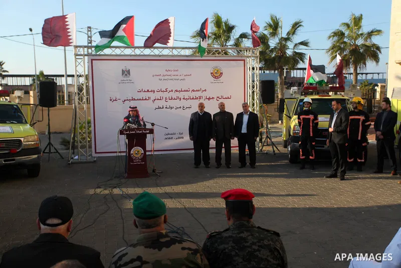 Qatar's Ambassador to the Palestinian Authority, Mohammed Al Emadi attends a ceremony to delivery vehicles and equipments with a donation from the State of Qatar for the benefit of the Palestinian Fire and Civil Defense...
