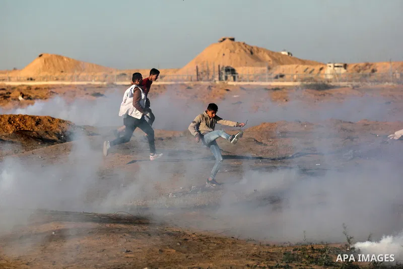 A wounded Palestinian protester is evacuated during clashes with Israeli troops following the tents protest where Palestinians demand the right to return to their homeland at the Israel-Gaza border, in Khan Younis in the...