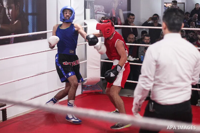 Palestinian fighters _men and youth categories _ compete during the " Palestine Boxing Championship ", in Gaza city, on December 20, 2019. Photo by Mahmoud Ajjour