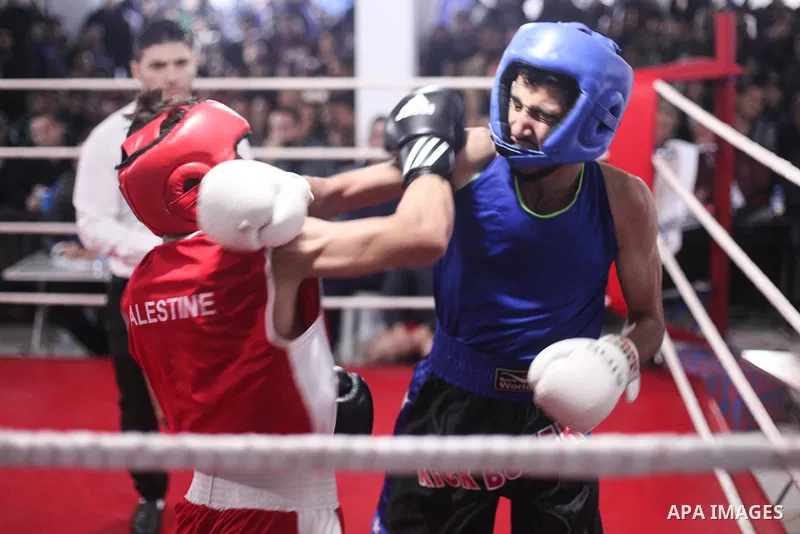 Palestinian fighters _men and youth categories _ compete during the " Palestine Boxing Championship ", in Gaza city, on December 20, 2019. Photo by Mahmoud Ajjour