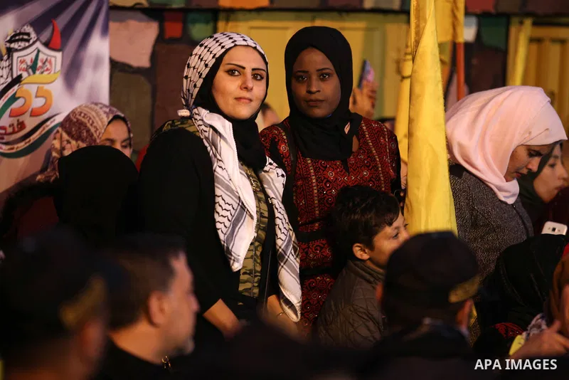 Palestinian supporters of the Fatah movement take part during a rally marking the fifty-fifth anniversary of the creation of the political party, in Gaza city on December 31, 2019. Photo by Mahmoud Ajjour