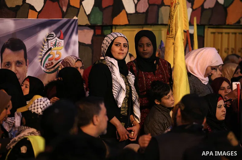 Palestinian supporters of the Fatah movement take part during a rally marking the fifty-fifth anniversary of the creation of the political party, in Gaza city on December 31, 2019. Photo by Mahmoud Ajjour