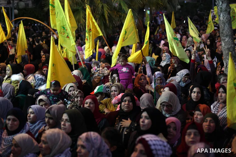 Palestinian supporters of the Fatah movement take part during a rally marking the fifty-fifth anniversary of the creation of the political party, in Gaza city on December 31, 2019. Photo by Mahmoud Ajjour