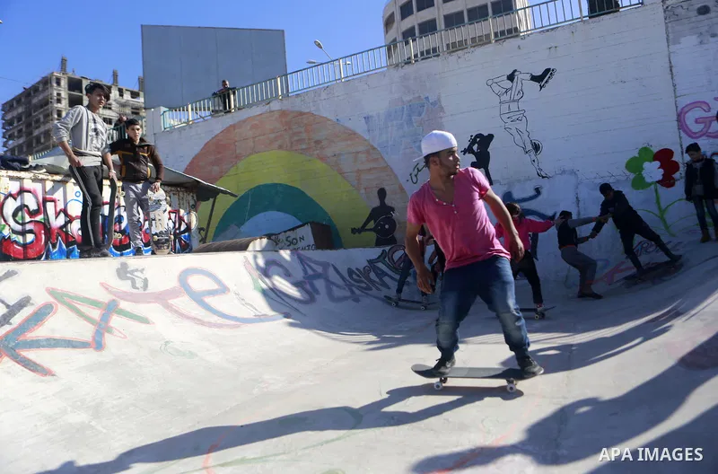 Palestinians ride skateboards during a trainning at Gaza seaport, on January 06, 2020 Skateboarding is an action sport which involves riding and performing tricks using a skateboard, as well as a recreational activity, a...