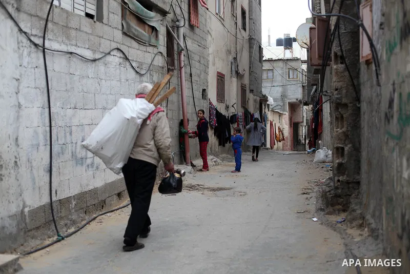 Palestinian refugees play outside their family house in al-Shati refugee camp, west Gaza city, on January 8, 2020. In 2018, President Trump cut aid to UNRWA and other Palestinian aid programs, threatening to topple the w...