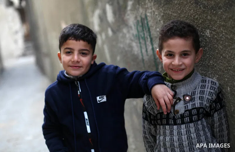 Palestinian refugees play outside their family house in al-Shati refugee camp, west Gaza city, on January 8, 2020. In 2018, President Trump cut aid to UNRWA and other Palestinian aid programs, threatening to topple the w...