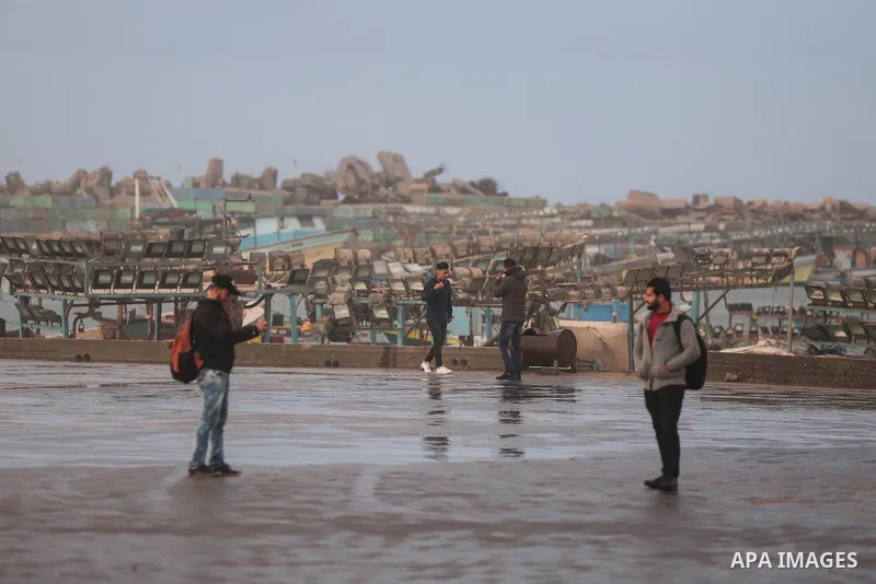 Palestinians enjoy at the sea port, during a storm day in Gaza City, on January 08, 2020. Photo by Ashraf Amra
