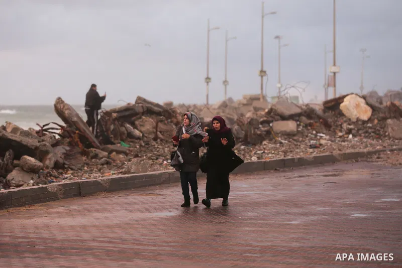 Palestinians enjoy at the sea port, during a storm day in Gaza City, on January 08, 2020. Photo by Ashraf Amra