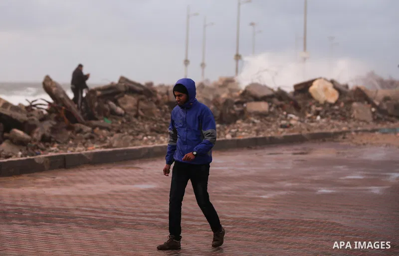 Palestinians enjoy at the sea port, during a storm day in Gaza City, on January 08, 2020. Photo by Ashraf Amra