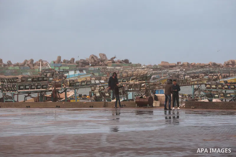 Palestinians enjoy at the sea port, during a storm day in Gaza City, on January 08, 2020. Photo by Ashraf Amra
