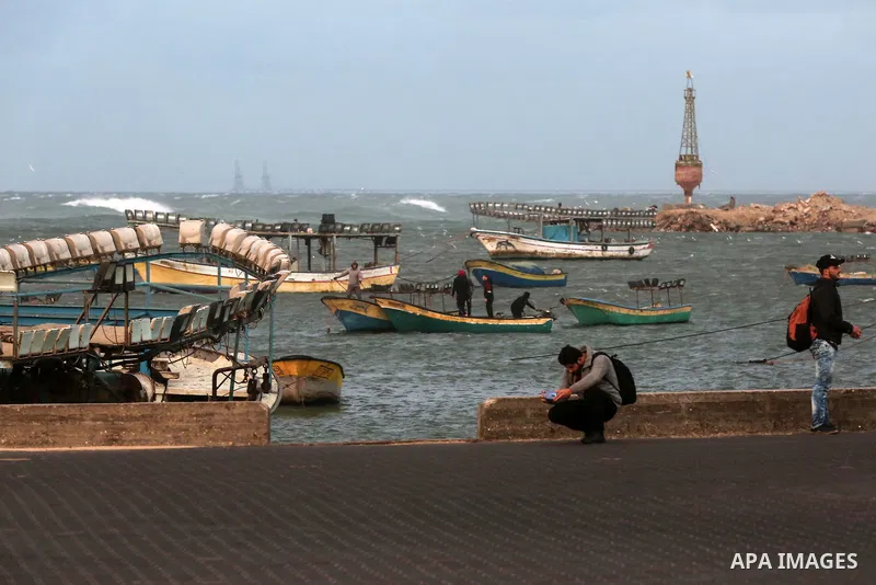 Palestinians enjoy at the sea port, during a storm day in Gaza City, on January 08, 2020. Photo by Ashraf Amra
