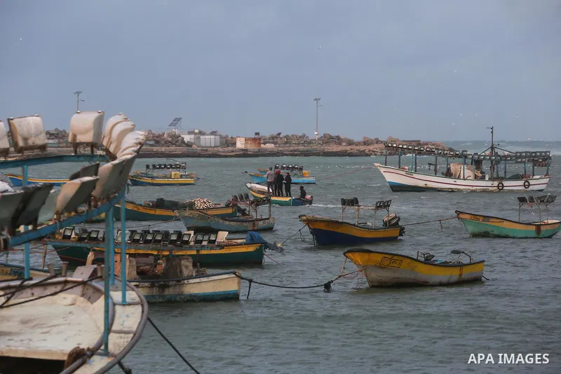 Palestinians enjoy at the sea port, during a storm day in Gaza City, on January 08, 2020. Photo by Ashraf Amra