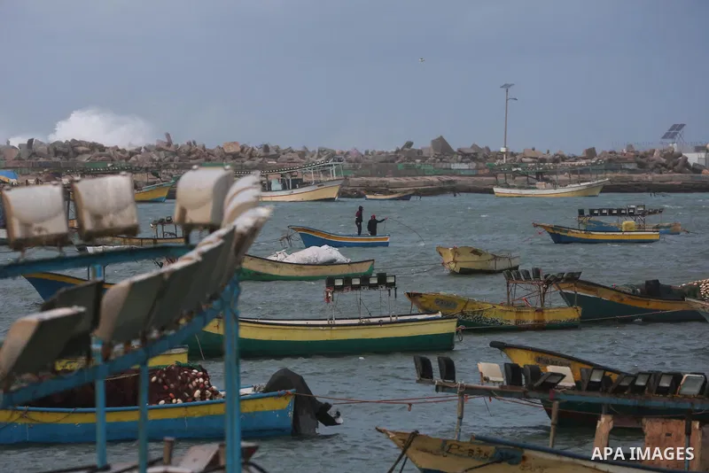 Palestinians enjoy at the sea port, during a storm day in Gaza City, on January 08, 2020. Photo by Ashraf Amra