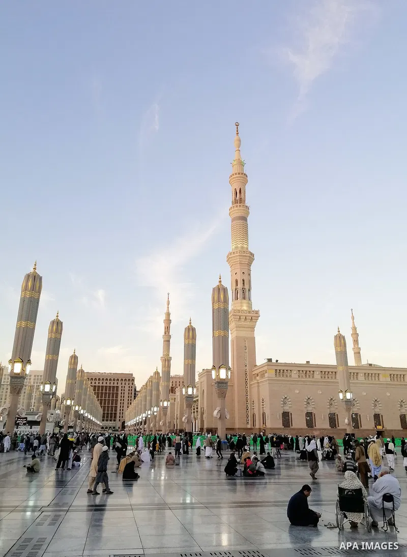 Muslim pilgrims pray at the Prophet's Mosque in the holy city of Medina, Saudi Arabia, on January 14, 2020. Thousands of pilgrims arrived in Makkah to perform Umrah. Photo by Stringer