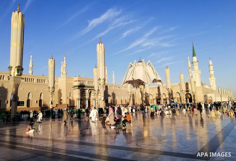 Muslim pilgrims pray at the Prophet's Mosque in the holy city of Medina, Saudi Arabia, on January 14, 2020. Thousands of pilgrims arrived in Makkah to perform Umrah. Photo by Stringer