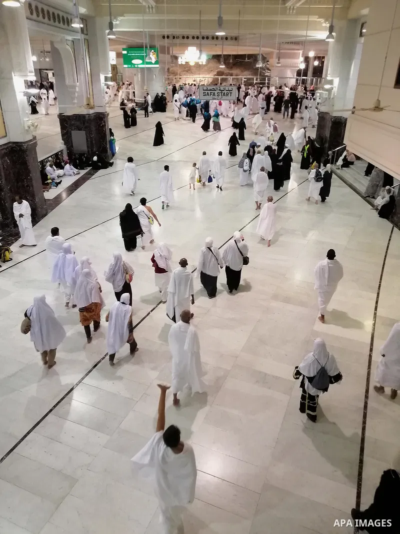 Muslim pilgrims walk in the Al-Safa direction (Safa and Marwah) where Muslims walk back and forth seven times during the Umrah pilgrimage rite at the grand Mosque in the holy city of Mecca , Saudi Arabia, on January 22,...