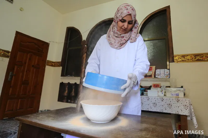 Palestinian nutritionist, Zainab Abid, 23, produces gluten-free flour from rice and lentils at her house, in Gaza city, on January 25, 2020 Gluten-free flour is the first product in the Gaza Strip to be used to treat whe...