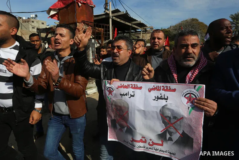 Palestinians supporters of the Democratic Front for the Liberation of Palestine (DFLP) holds banners depicting U.S. President Donald Trump during a protest against the U.S. Middle East peace plan, in front of the headqua...