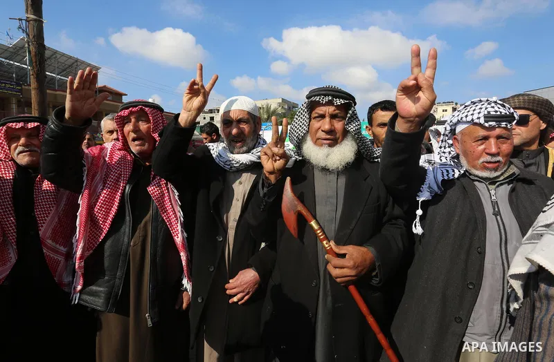 Palestinian demonstrators chant slogans during a protest against US President Donald Trump's expected peace plan in Rafah in the southern of Gaza Strip on January 28, 2020. Photo by Ashraf Amra