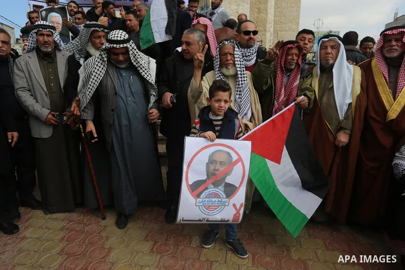 Palestinian demonstrators chant slogans during a protest against US President Donald Trump's expected peace plan in Rafah in the southern of Gaza Strip on January 28, 2020. Photo by Ashraf Amra