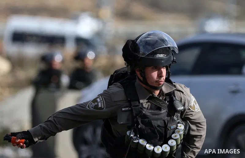 Israeli security forces fires tear gas at the Palestinian youth during clashes with Palestinian protesters following a demonstration against US President Donald Trump's Century Deal "expected peace plan" near the settlem...