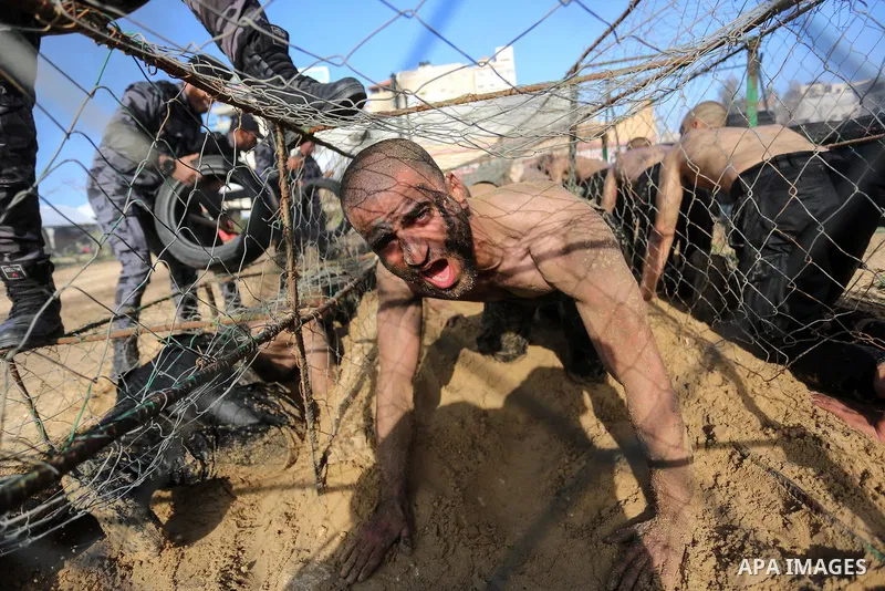 Palestinian students show off their military skills during a c at a police academy, in Gaza City January 30, 2020. Photo by Ashraf Amra