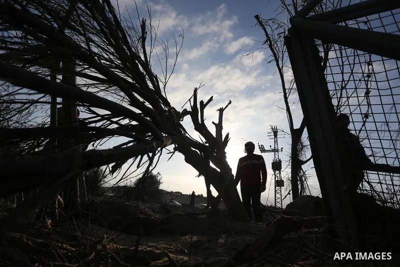 Palestinians inspect a site after it was targeted by Israeli airstrike in Rafah in the southern Gaza Strip, on January 31, 2020. Photo by Ashraf Amra