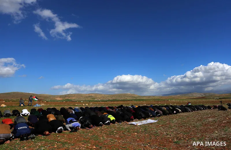 Palestinian protesters pray during a protest against US President Donald Trump's Century Deal "expected peace plan", near the West Bank village of Tamun near the Jordan Valley on January 31, 2020. Donald Trump has launch...