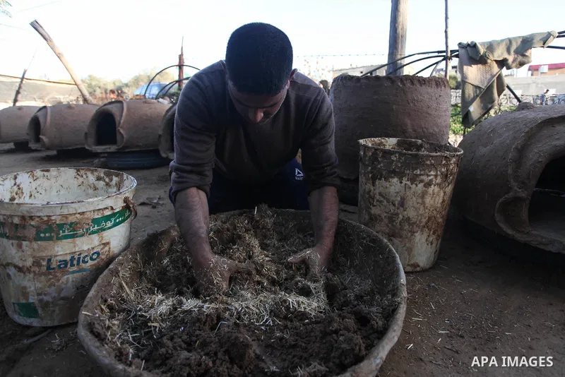 A Palestinian man Salah Qudaih, 39, prepares the clay ovens to earn livelihood, in Khan Younis in the southern of Gaza Strip, on February 2, 2020. Qudih has been manufactured ovens for 21 years using iron, clay and cemen...