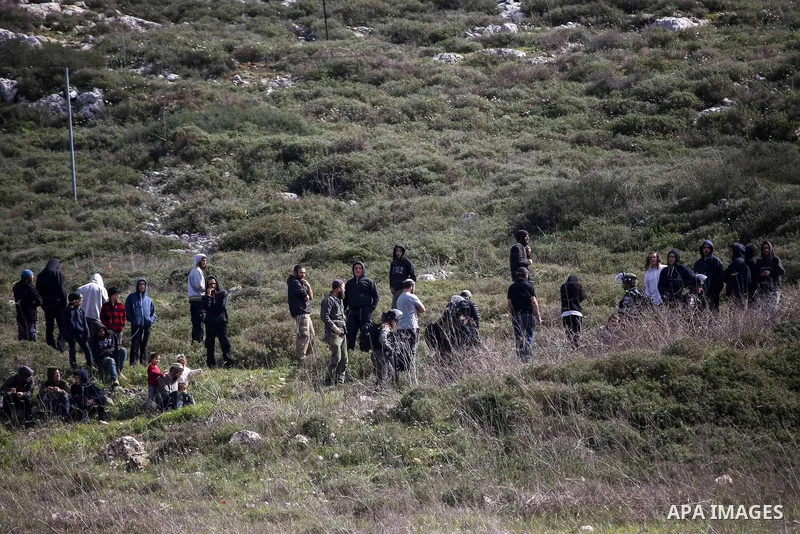 Israeli settlers stand during a protest Palestinian demonstrators against Israeli settlements near the West Bank city of Nablus on February 21, 2020. Photo by Shadi Jarar'ah