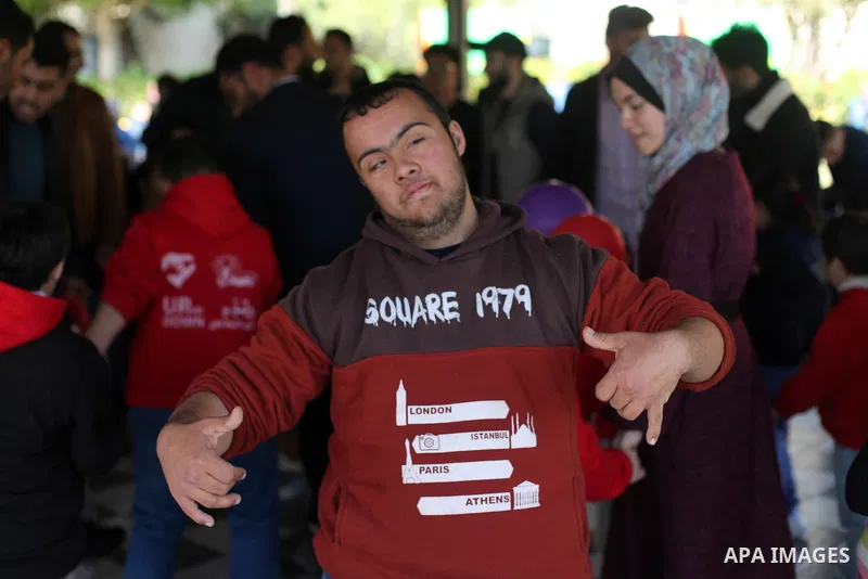 Palestinians of the "Ehsan" campaign" visit children with Down syndrome during an entertainment day, at association "Right of life" in Gaza city, on February 29, 2020. Photo by Mahmoud Ajjour