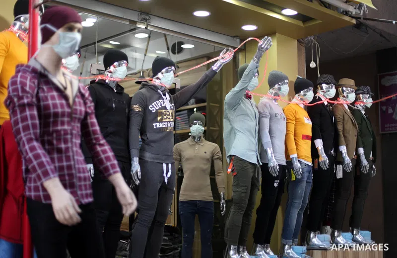 Dressed-up mannequins with health masks placed on their heads are displayed outside a clothing shop in Gaza City on March 7, 2020, as part of an effort by a Palestinian merchant to spread awareness about COVID-19 coronav...
