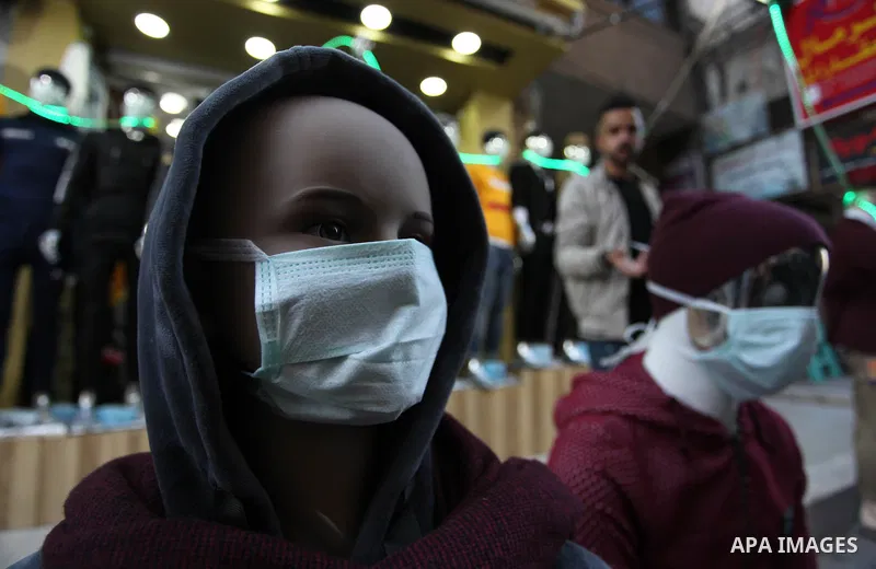 Dressed-up mannequins with health masks placed on their heads are displayed outside a clothing shop in Gaza City on March 7, 2020, as part of an effort by a Palestinian merchant to spread awareness about COVID-19 coronav...