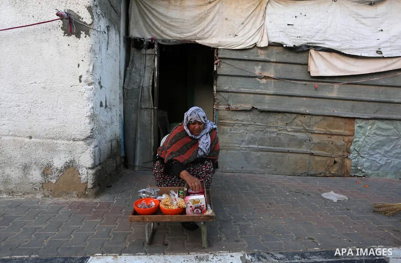 Palestinian women Faiza Al-Najjar, 61, sells his goods at a street, in Khan Yunis in the southern Gaza Strip on March 8, 2020. International Women's Day (IWD) is celebrated on the 8th of March every year around the world...