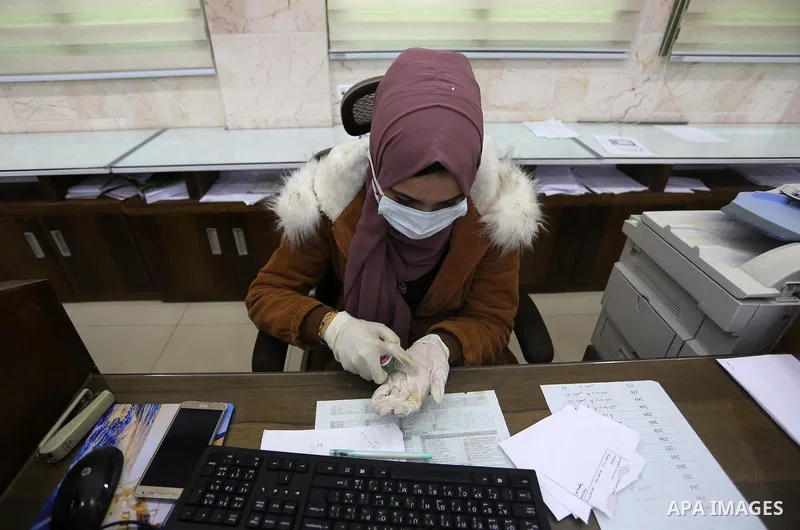 Palestinian employees municipal of Khan Younis, wearing masks as a preventive measure amid fears of the spread of the novel coronavirus, in Khan Younis in the southern Gaza Strip on March 9, 2020. Photo by Ashraf Amra