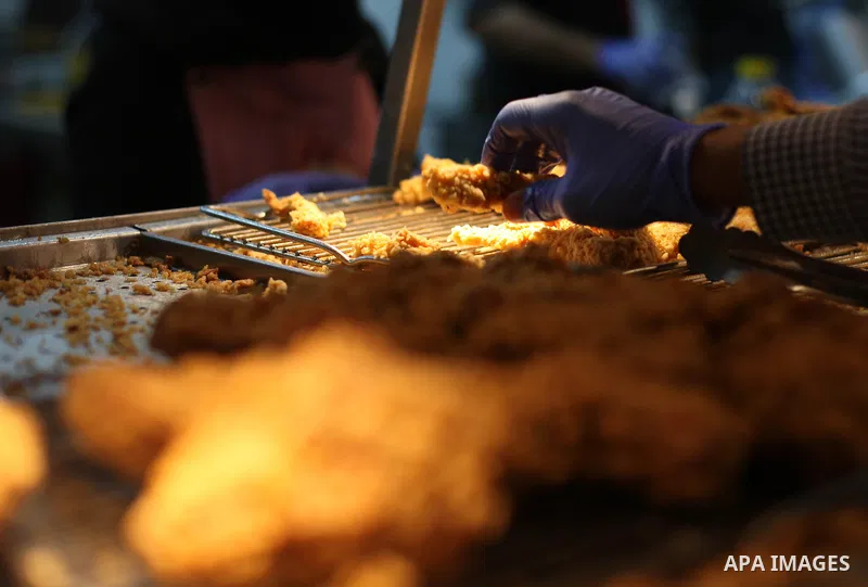 Palestinian youth serve the fast food for customers, at the Chicken Broast in Gaza City, on March 16, 2020. Chicken Broast is a restaurant located in Egypt, serving a selection of Sandwiches that delivers across Miami -...