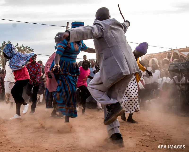 A picture taken on December 26, 2019, show Members of a Nubian singing and dance group perform "alkering dance" at the Nuba Mountains, sudan. Photo by faiz Abu bakr