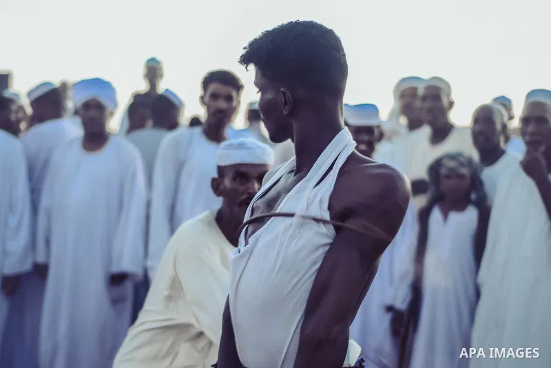 Sudanese take part in a heritage party In the city of Shendi in northern Sudan on February 24, 2020. The lash of the guests is usually one of the customs and traditions of the Ja’alin tribe in Sudan, and they have pride...