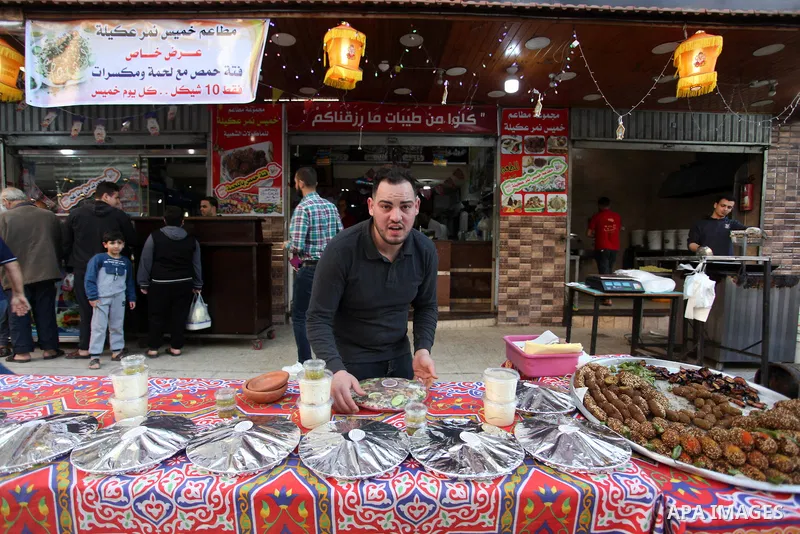 A Palestinian vendor prepares chickpeas known as "Hummus" for breakfasting on the Muslim holy fasting month of Ramadan in Gaza city, on April 29, 2020. Muslims around the world celebrate the holy month of Ramadan by pray...